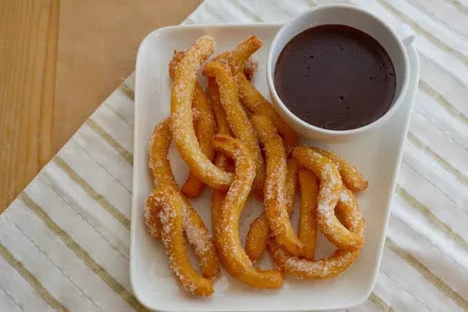 Churros con cioccolato fondente